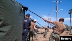 США отправили на базу в Гуантанамо задержанных мигрантов1